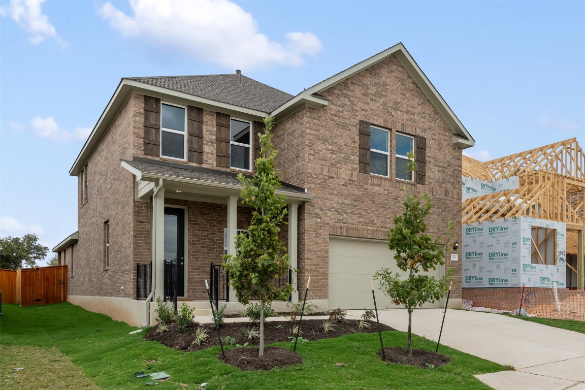 a front view of a house with a yard