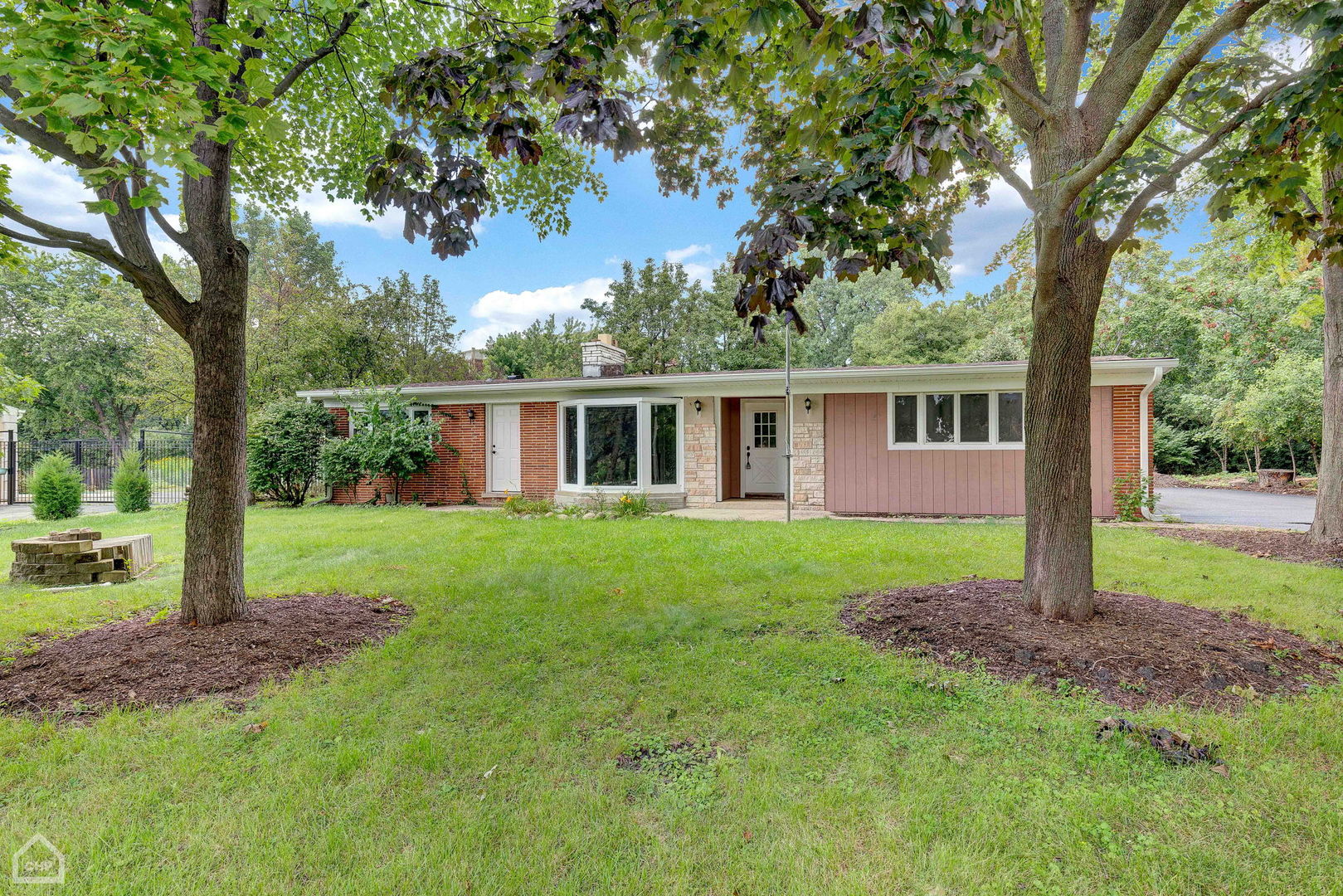 a house view with a garden space