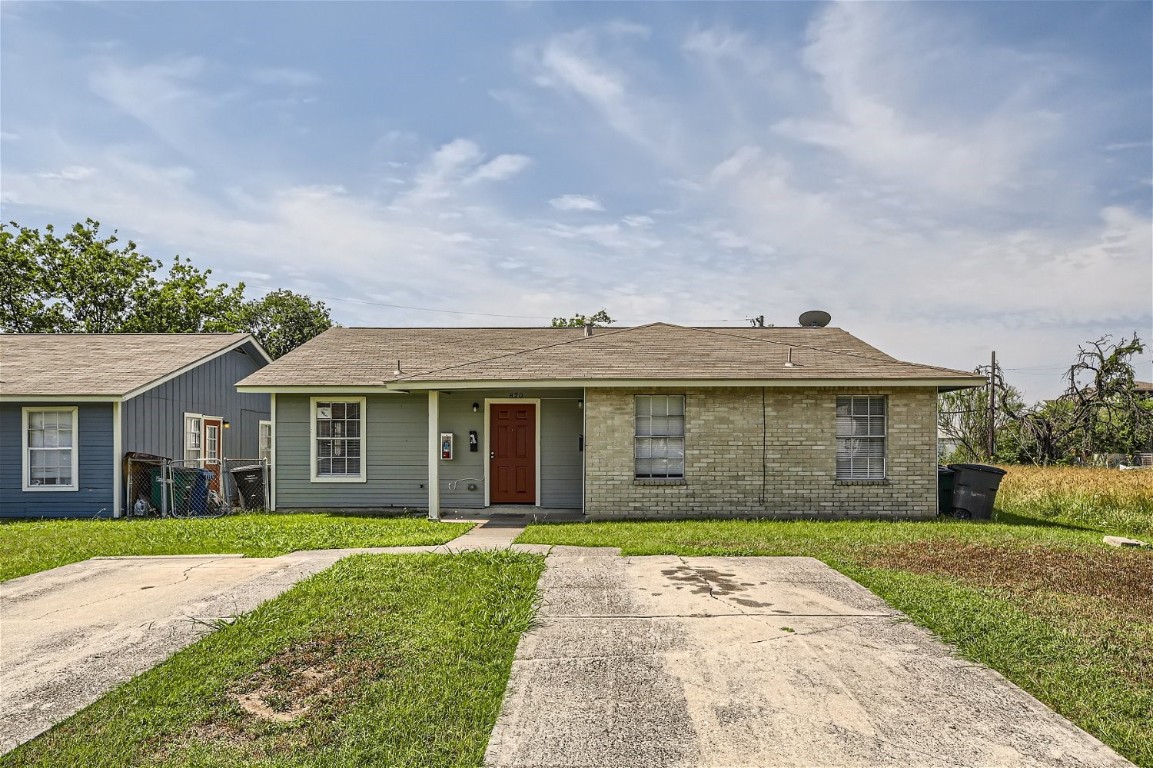 front view of a house with a yard