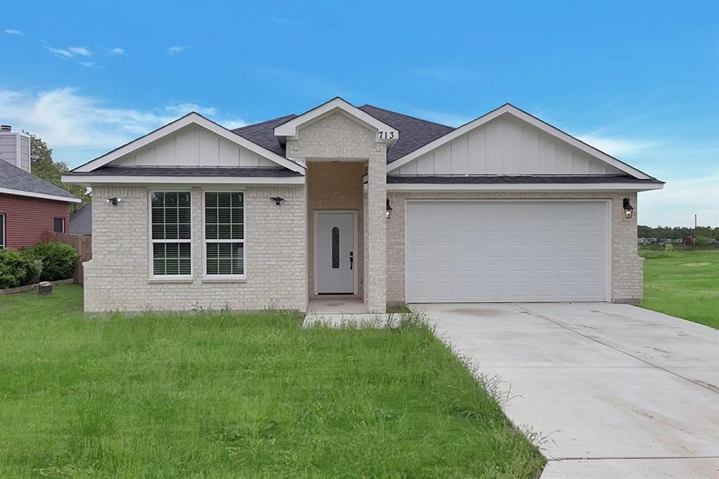 a front view of a house with yard