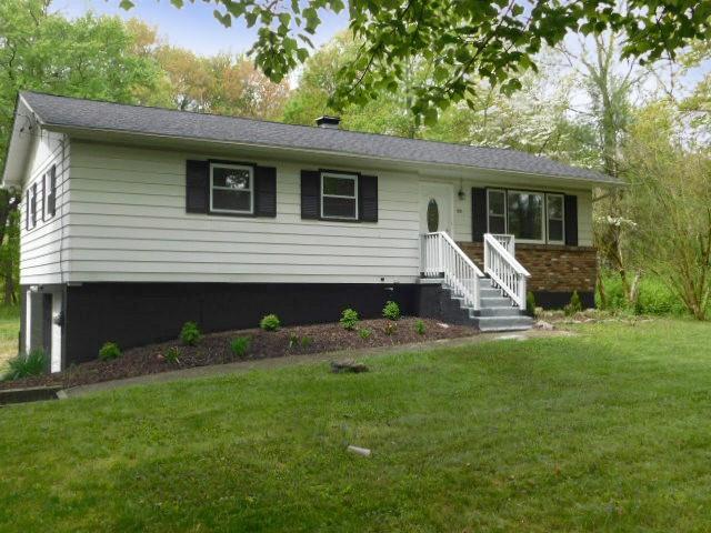 a view of a house with a backyard