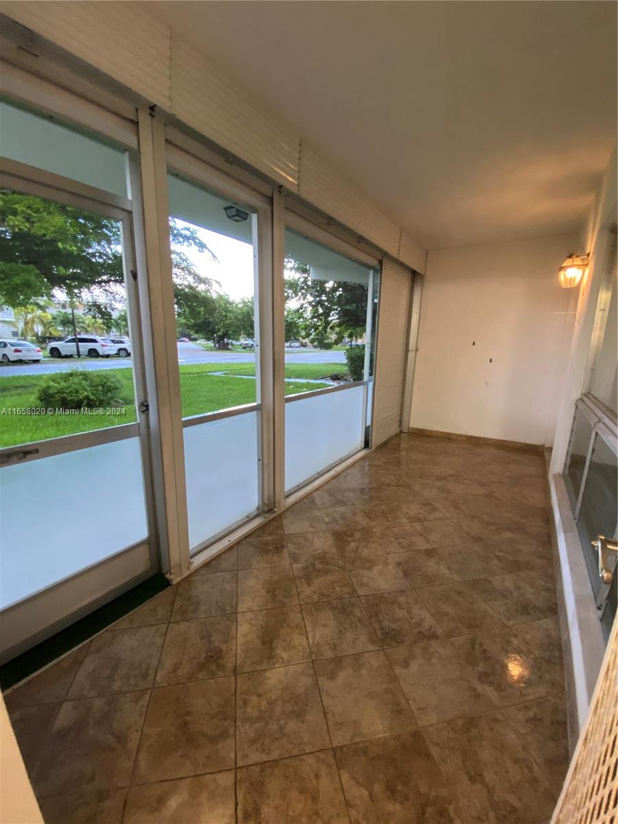 a view of an empty room with a large window