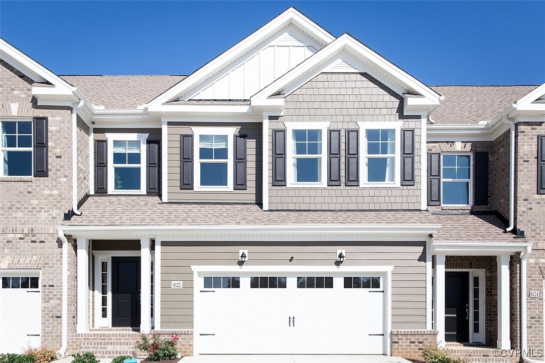 Craftsman house featuring a garage