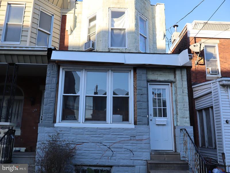 a front view of a house with glass windows