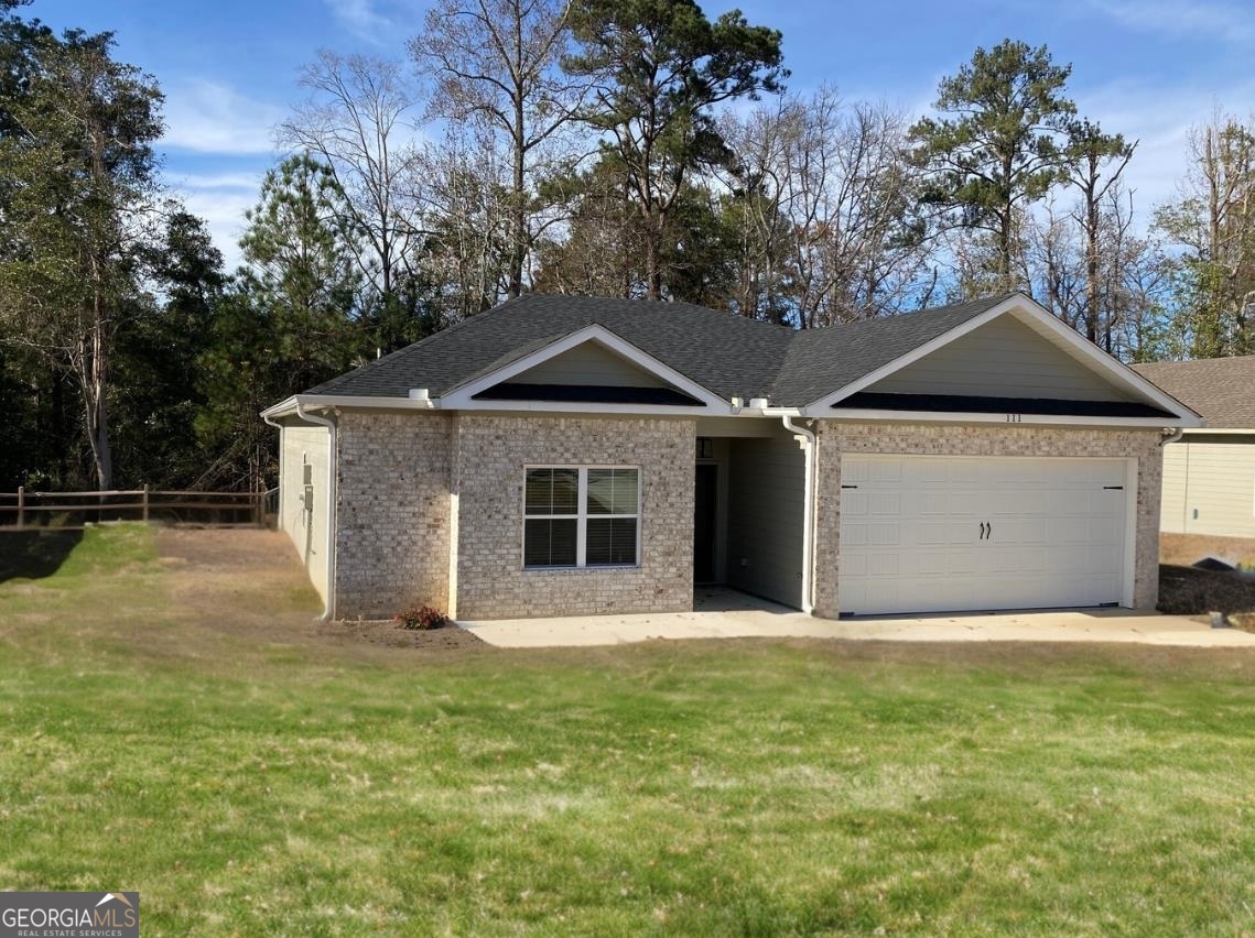 a front view of a house with yard