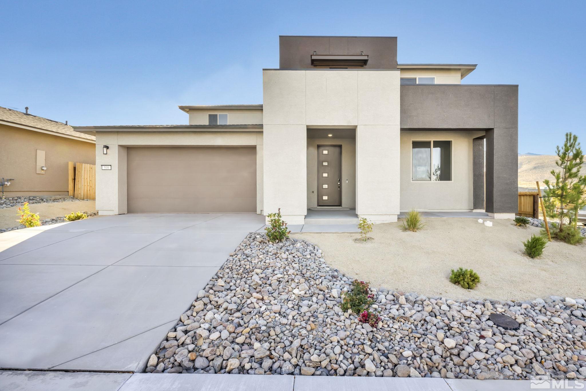 a front view of a house with a garage