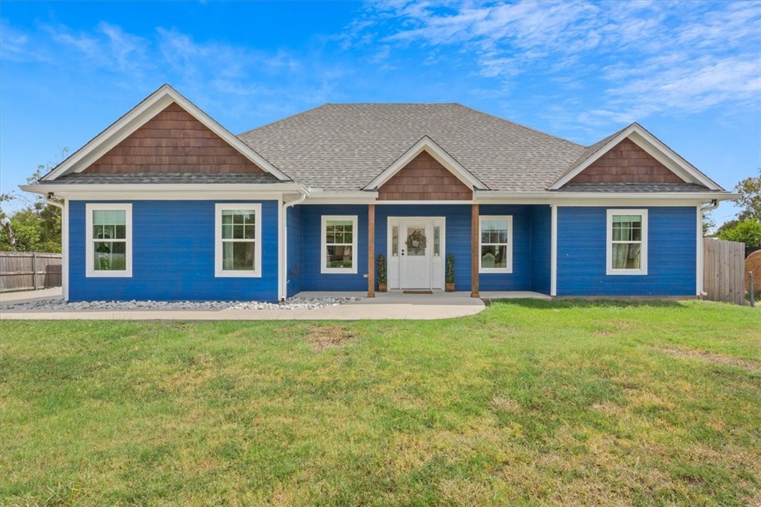 a front view of a house with yard