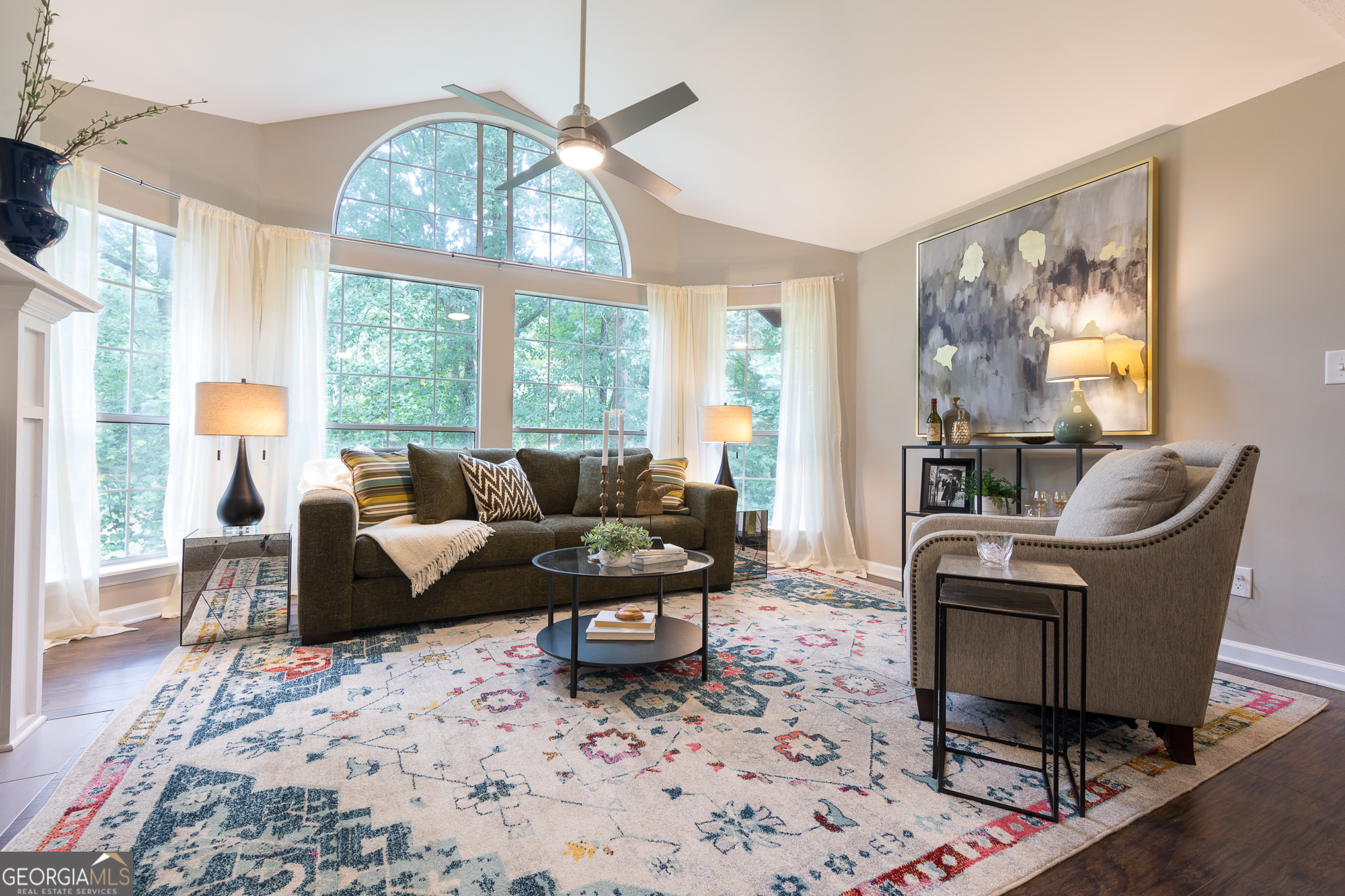 a living room with furniture and a large window