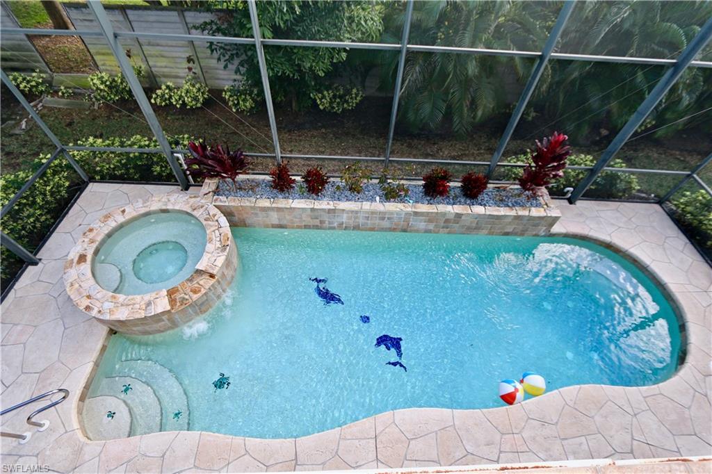 a view of swimming pool from a bathroom