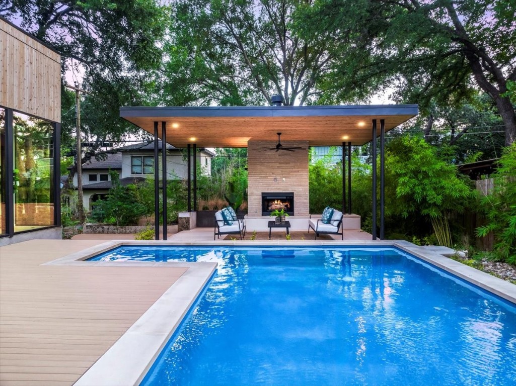 a view of a patio with swimming pool table and chairs