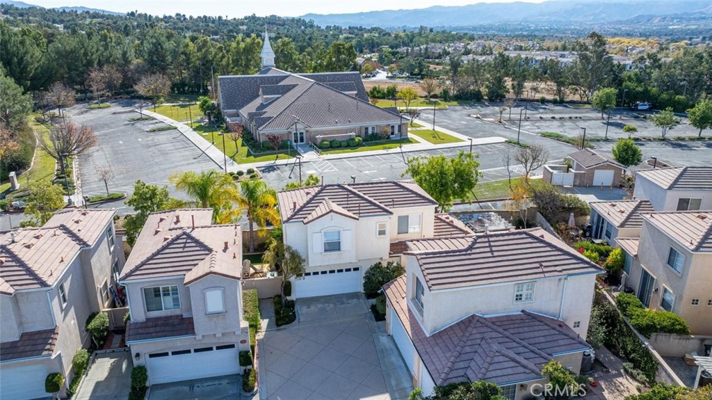 an aerial view of a house with garden space and street view