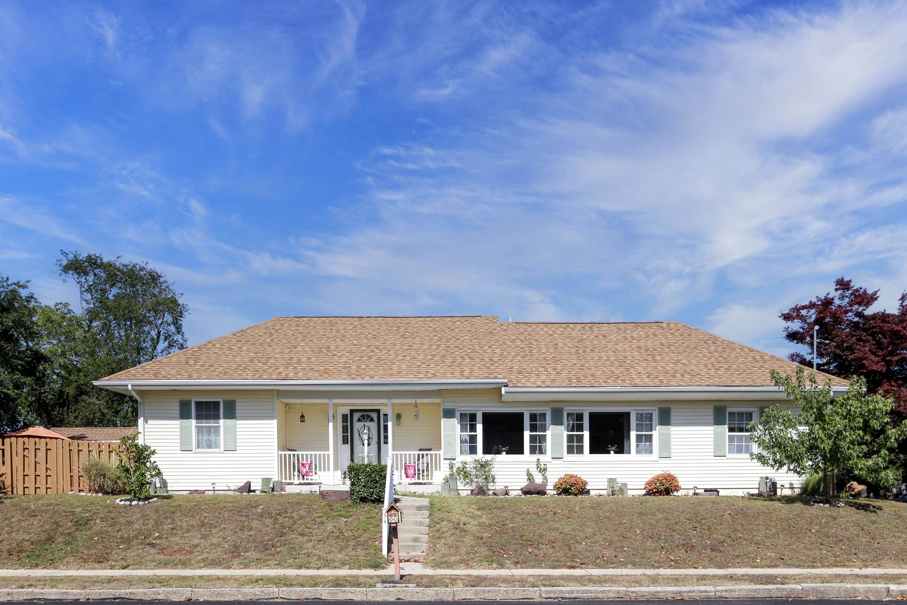 a front view of a house with garden