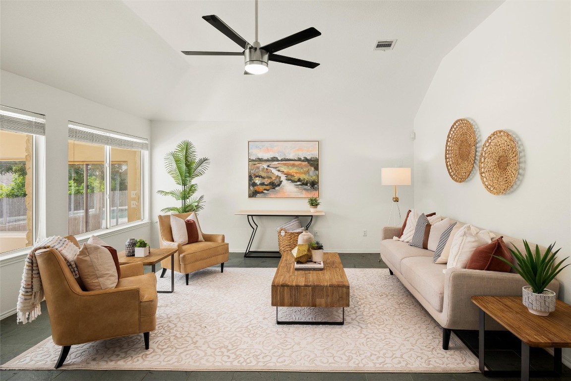 a living room with furniture and a large window