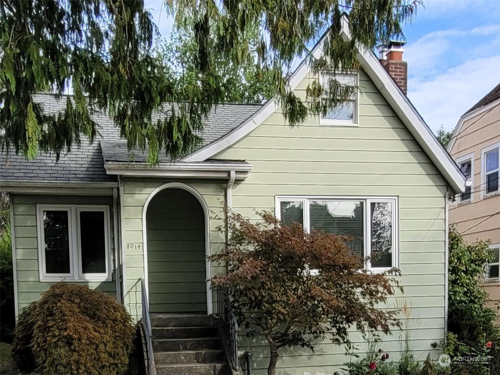 a view of a house with a garden