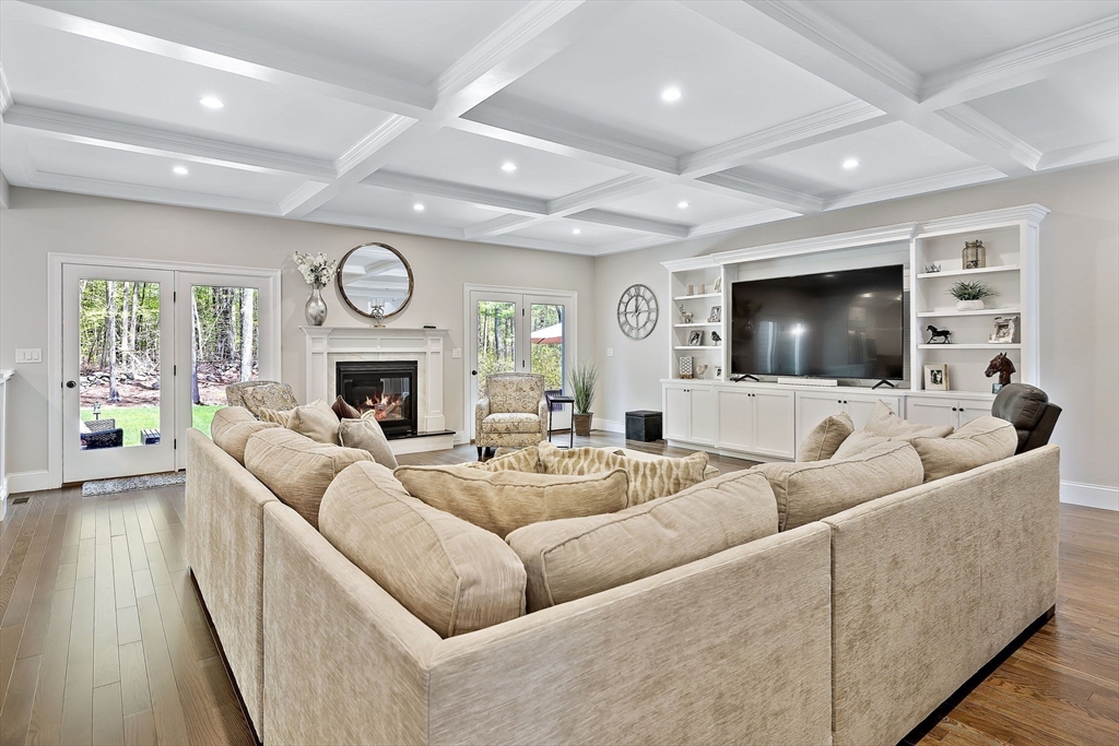 a living room with furniture fireplace and a flat screen tv