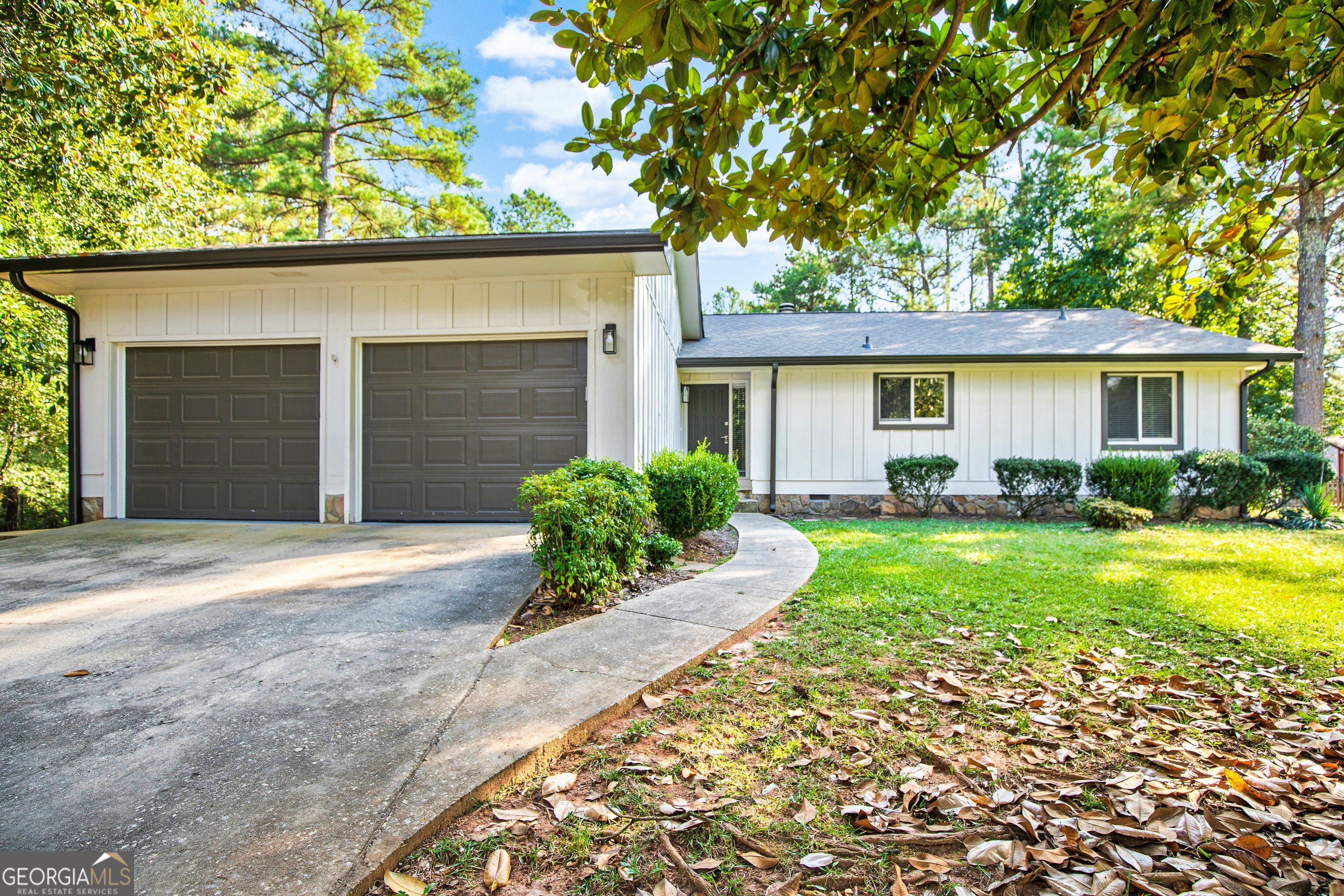 a front view of house with yard and green space