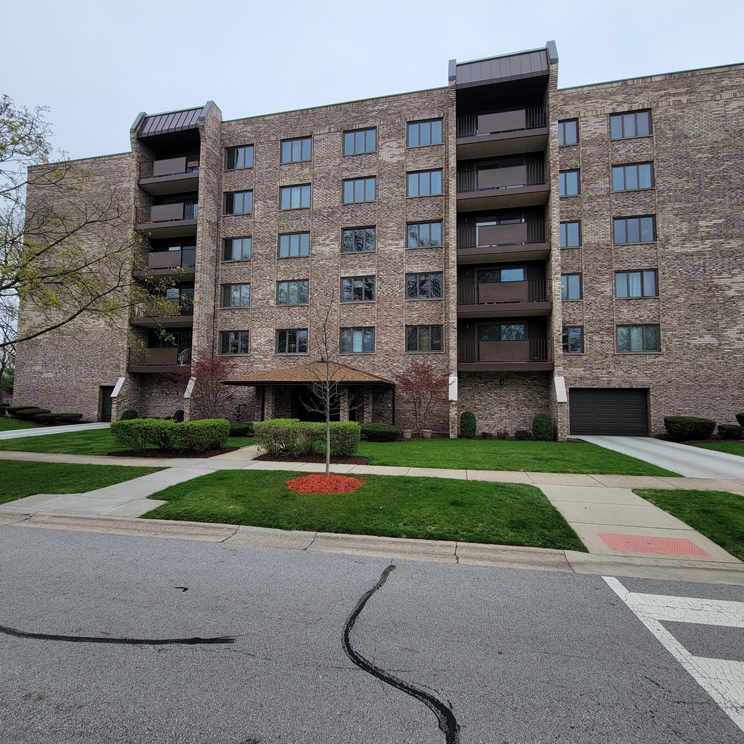 a view of a building with a yard