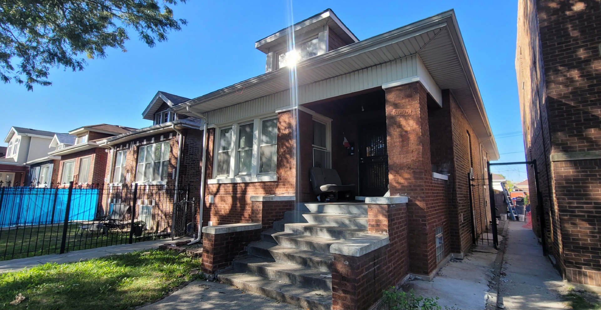 a view of front door of house with yard