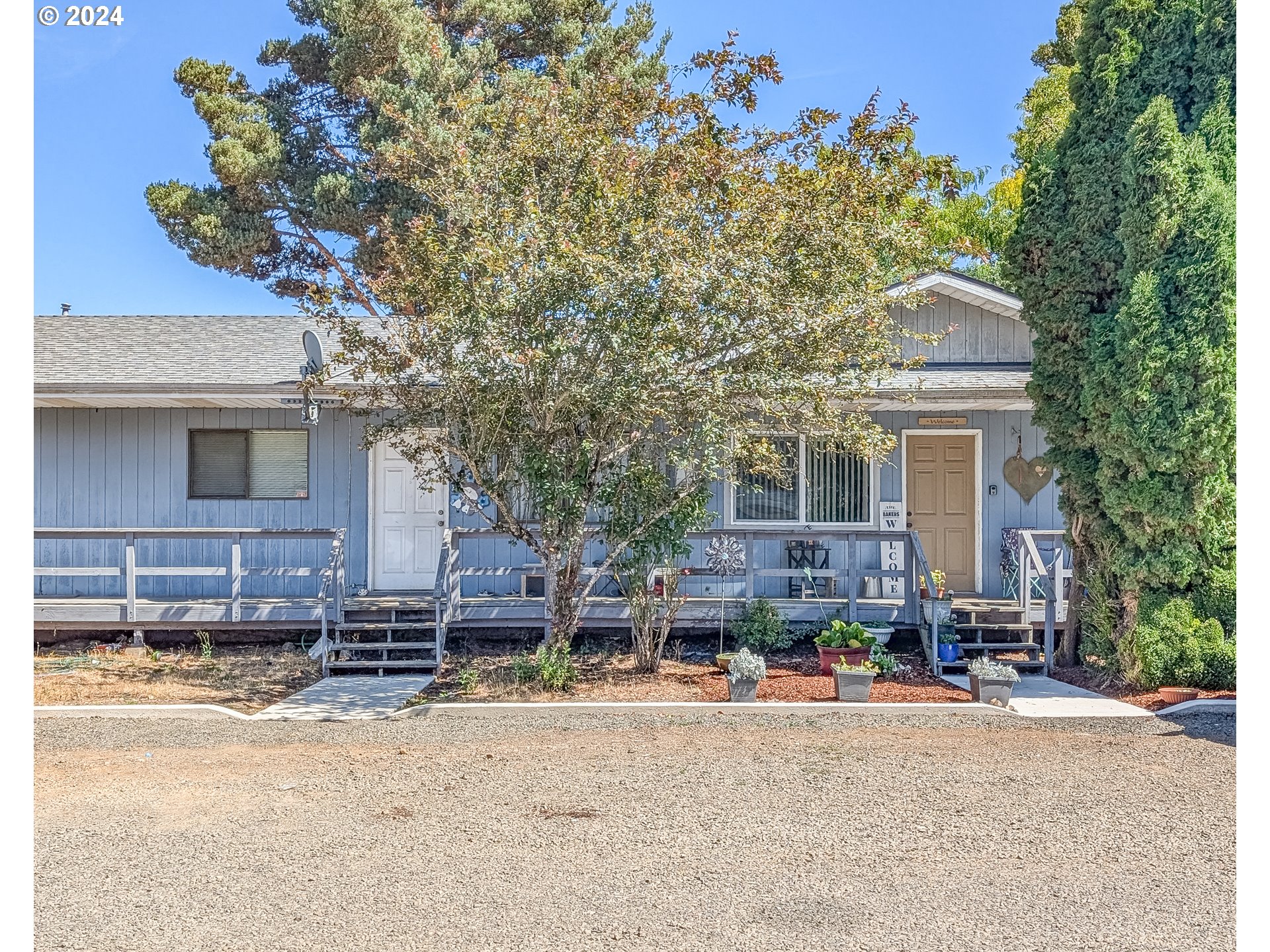 front view of a house with a trees