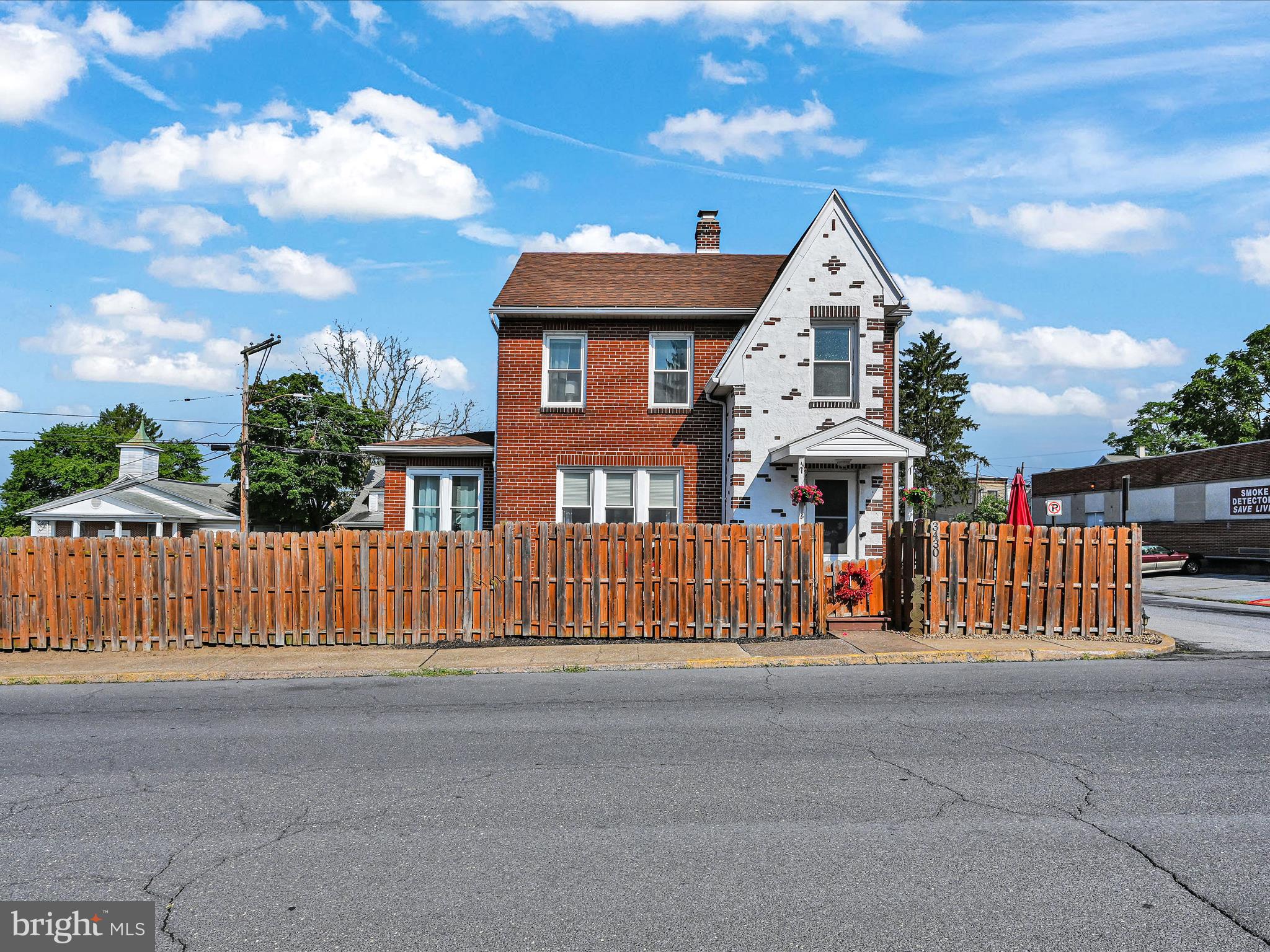 a view of a house with a fence