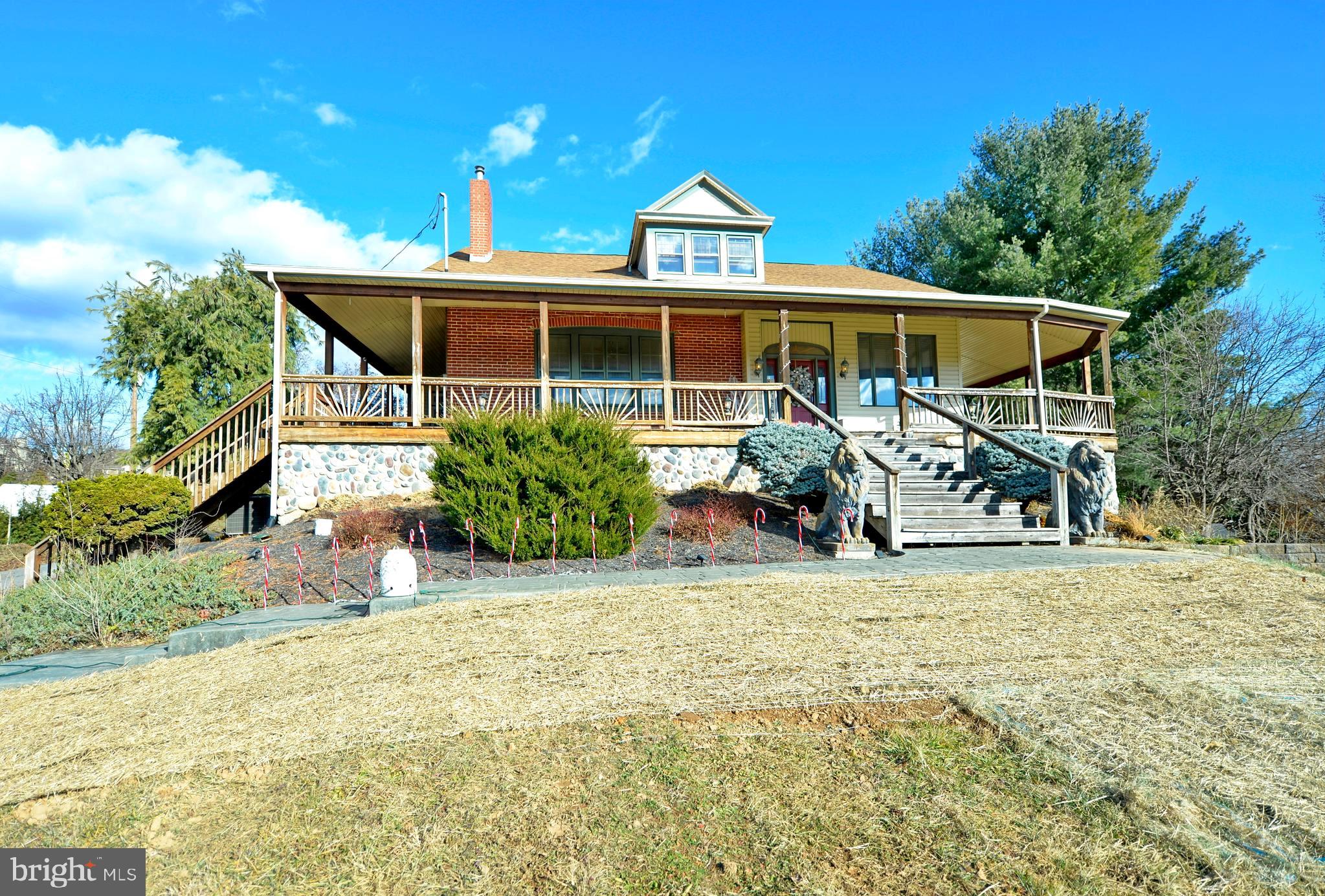 a front view of a house with a yard and a garage