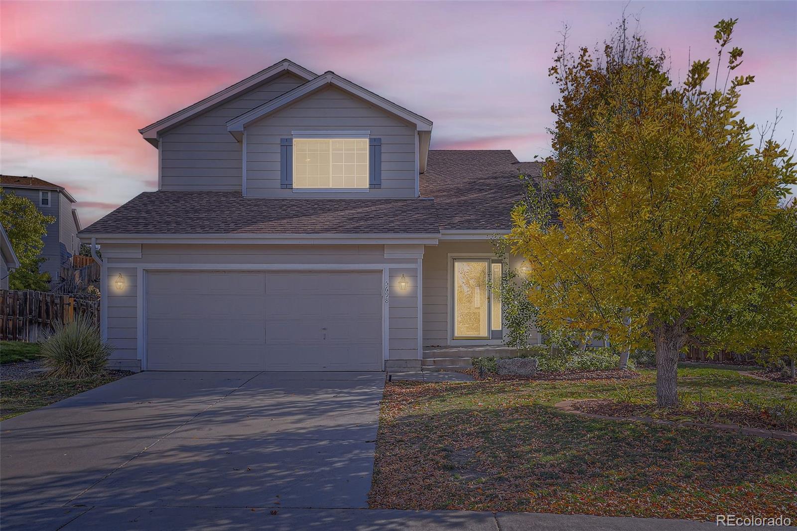 a front view of a house with yard