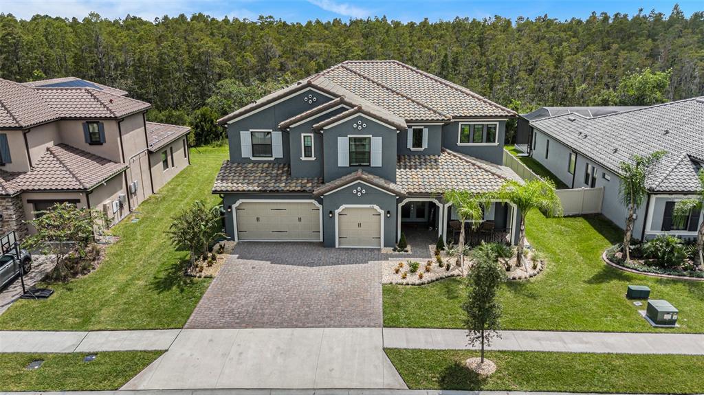 a aerial view of a house with a yard