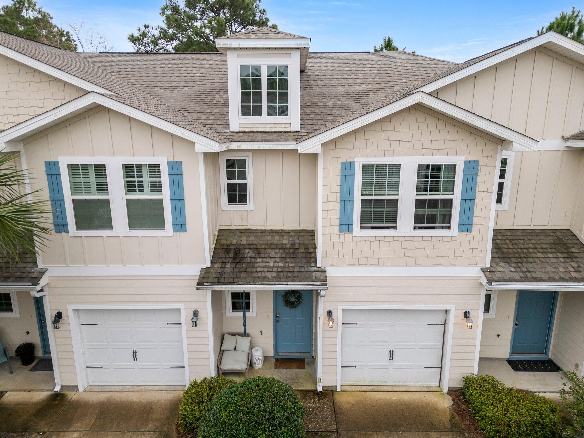 a front view of a house with a garage