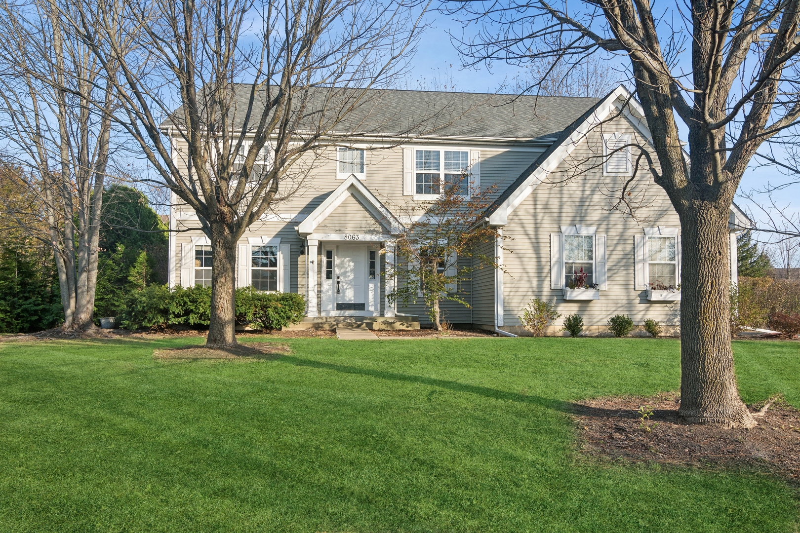 a front view of a house with a yard