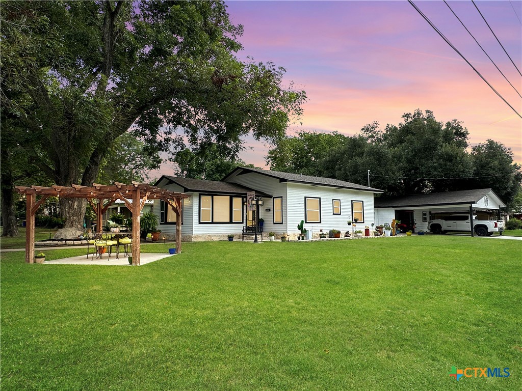 a front view of a house with garden