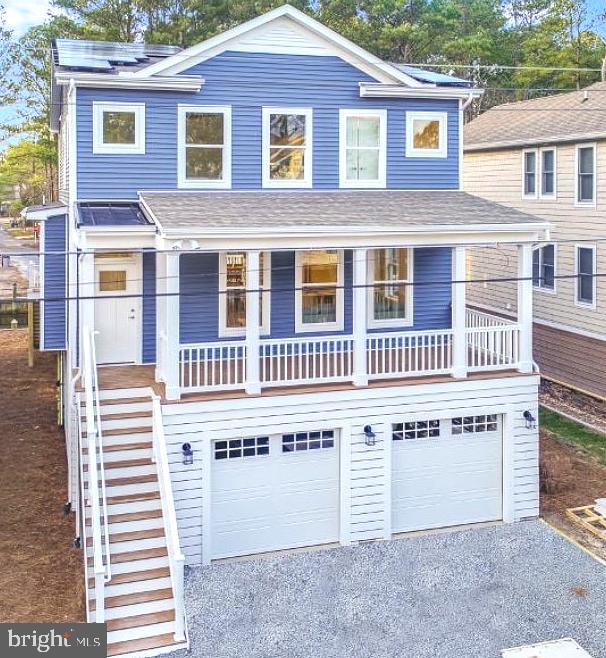 a front view of a house with a garage