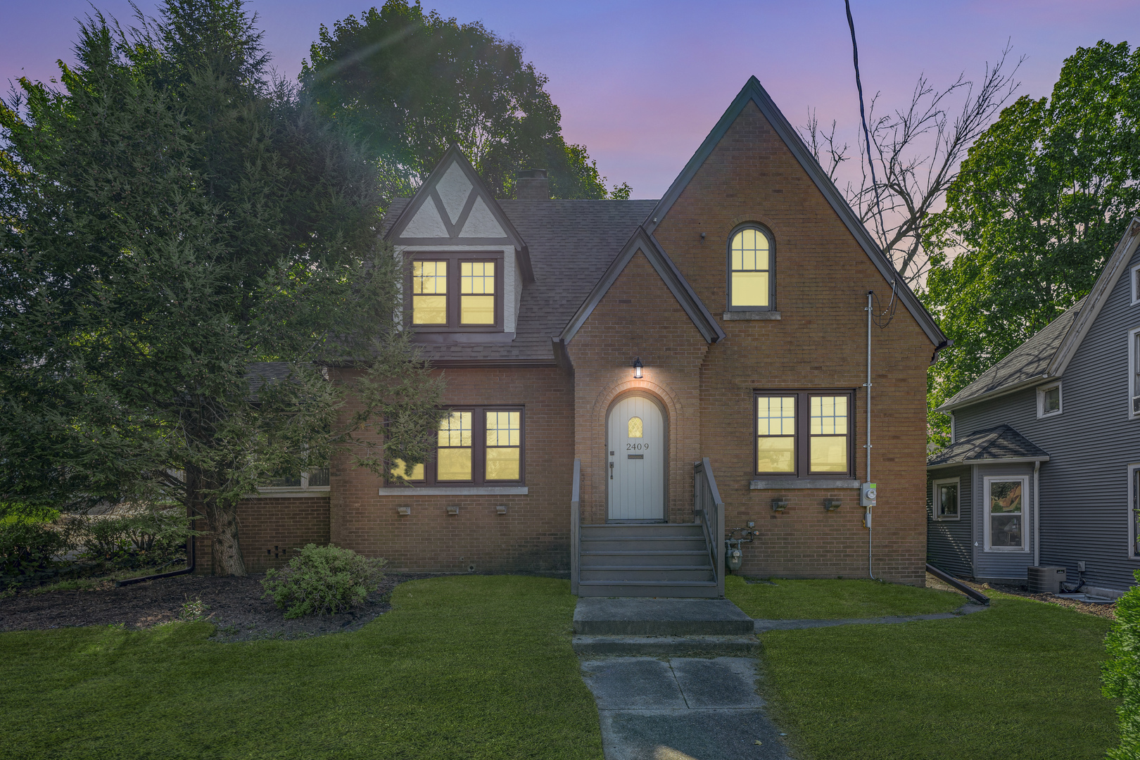 a front view of a house with a yard