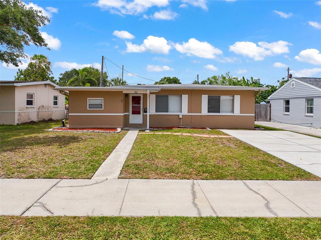 front view of house with a yard