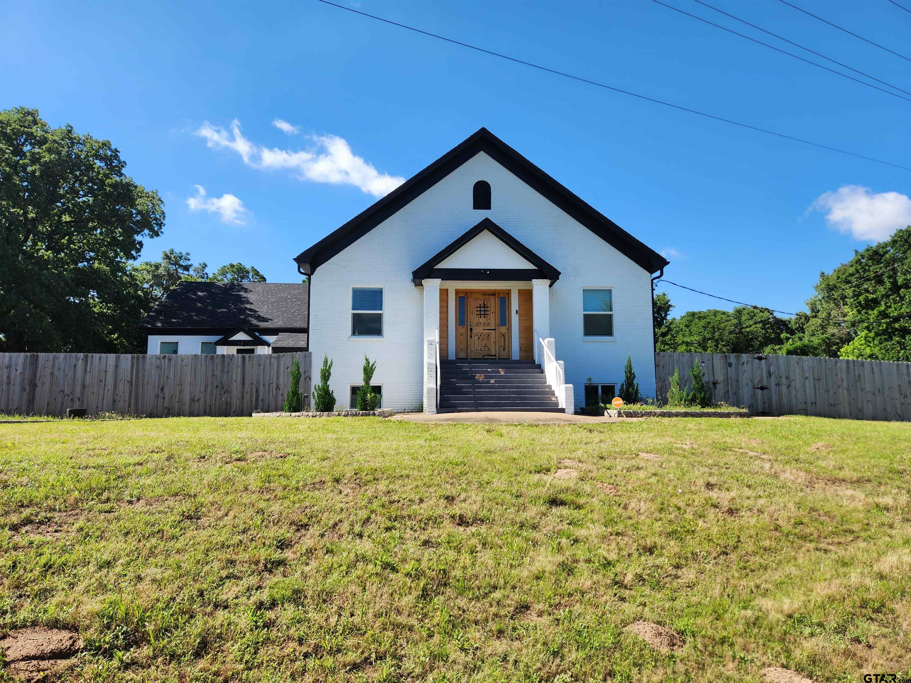 a house with yard in front of it