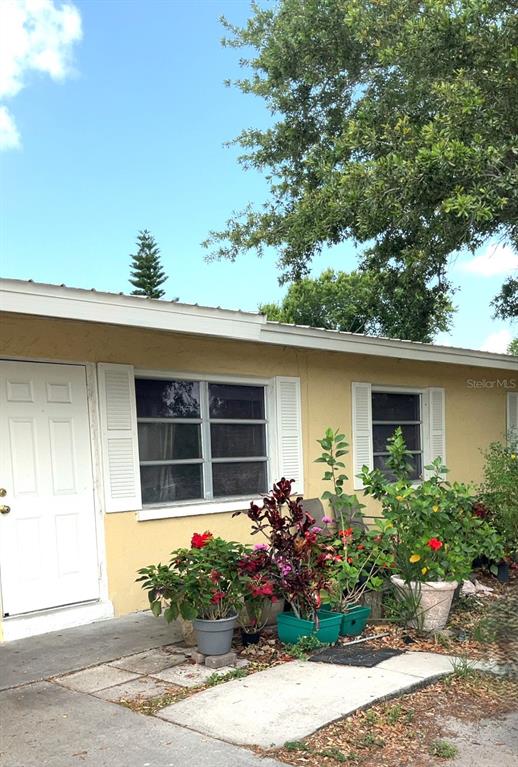 front view of a house with a garden