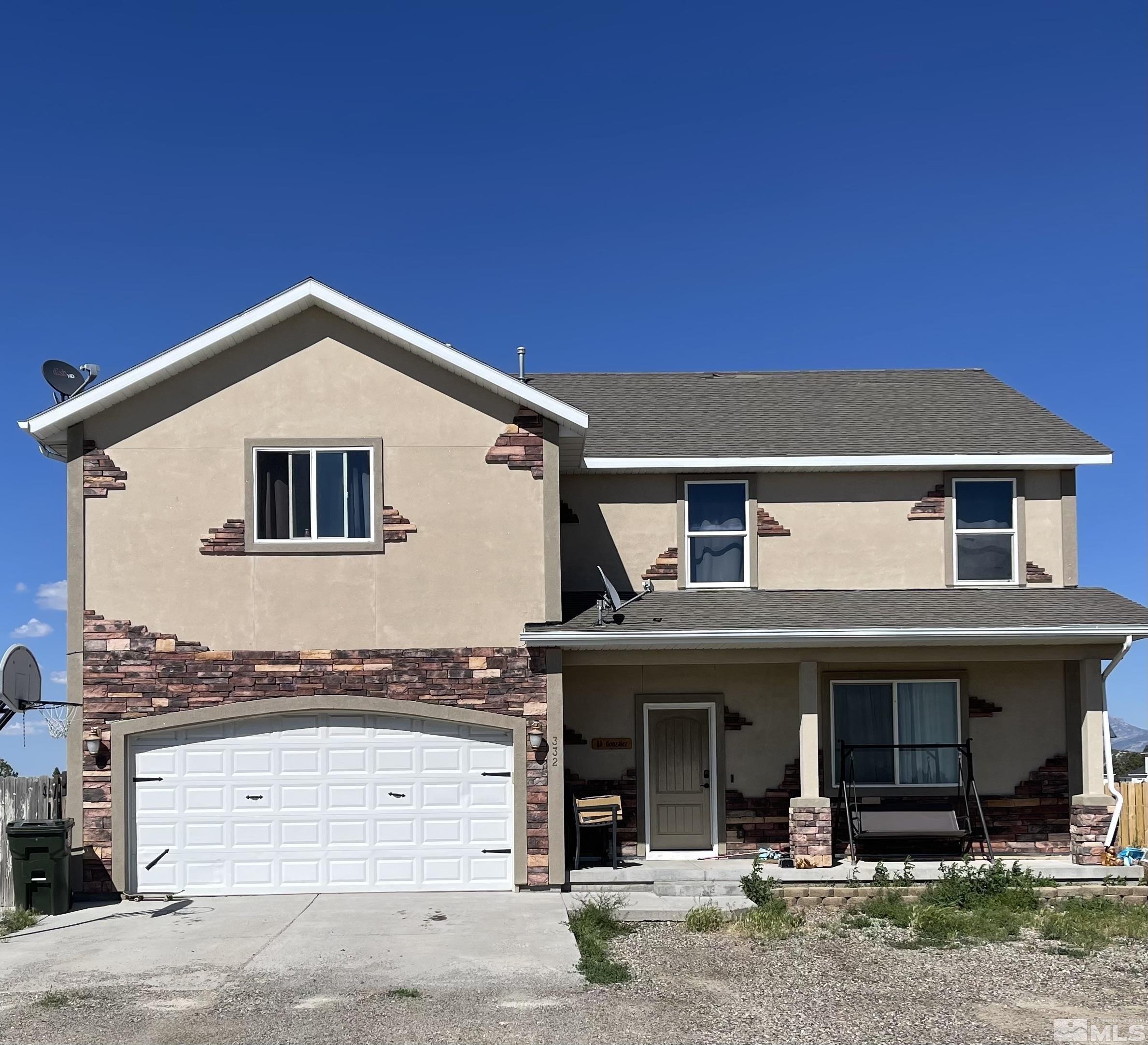 a front view of a house with a garage