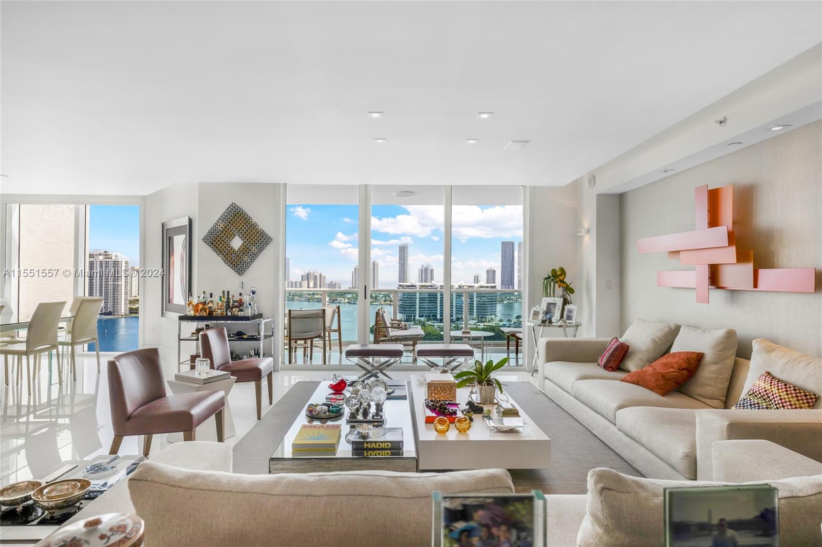 a very nice looking living room with furniture and a large window