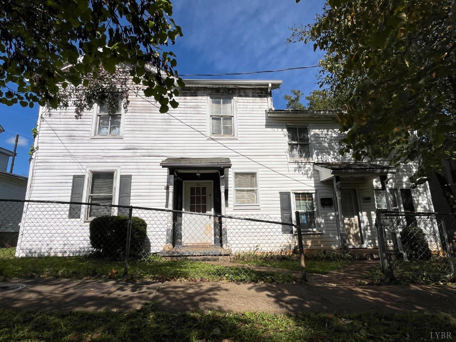 a front view of a house with yard