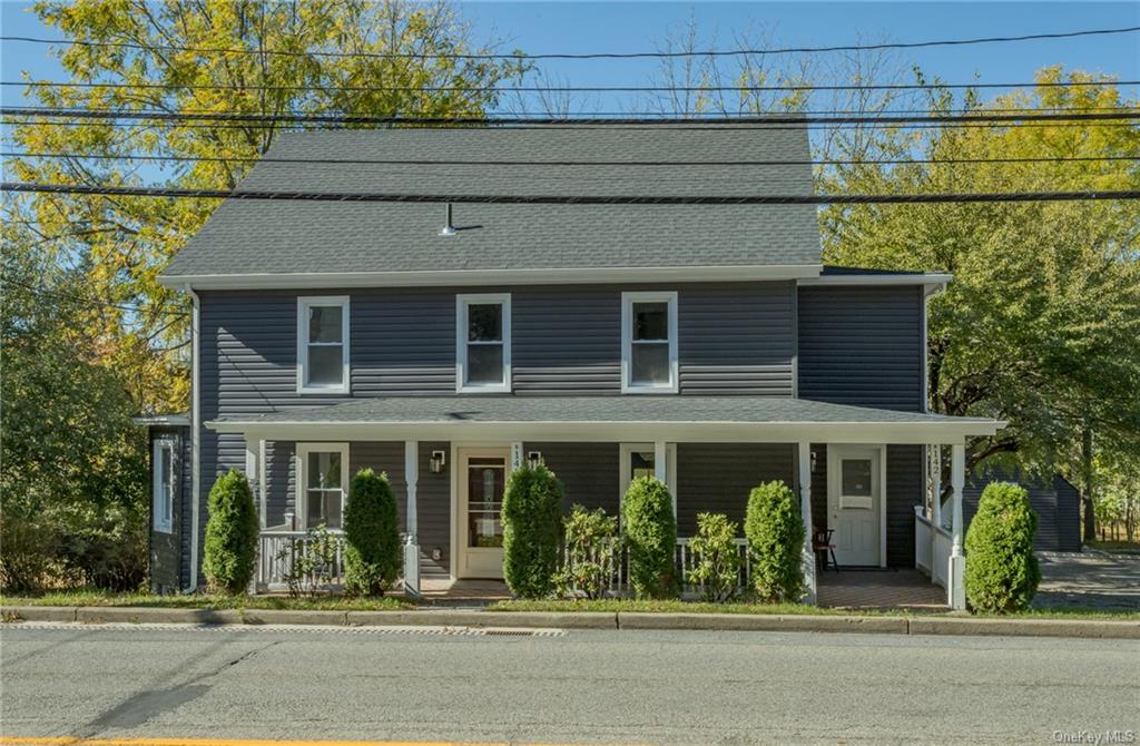 View of front of house with covered porch