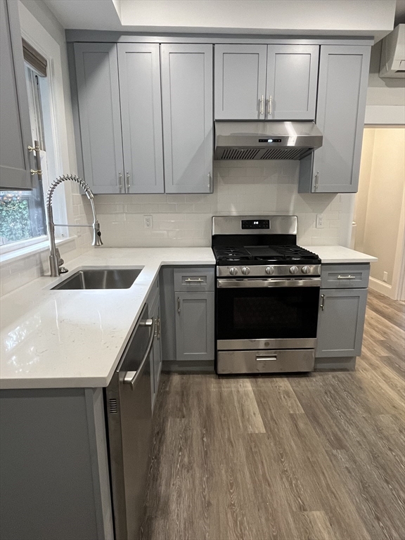 a kitchen with a stove and a sink