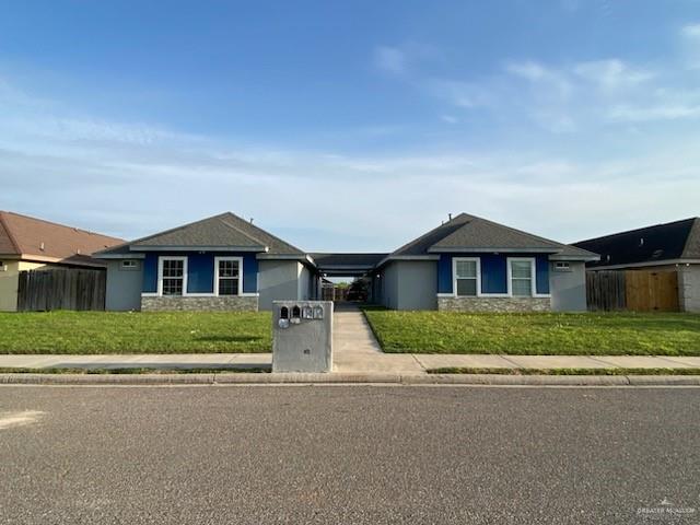 a front view of a house with a yard