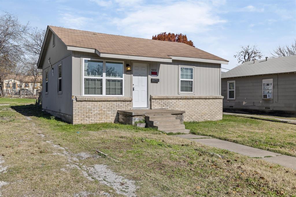 front view of house with a yard