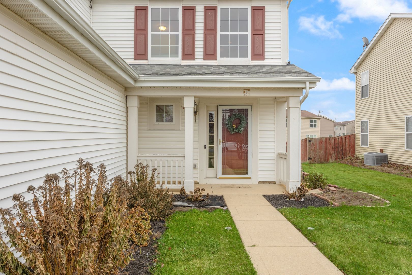 a view of a brick house with a yard