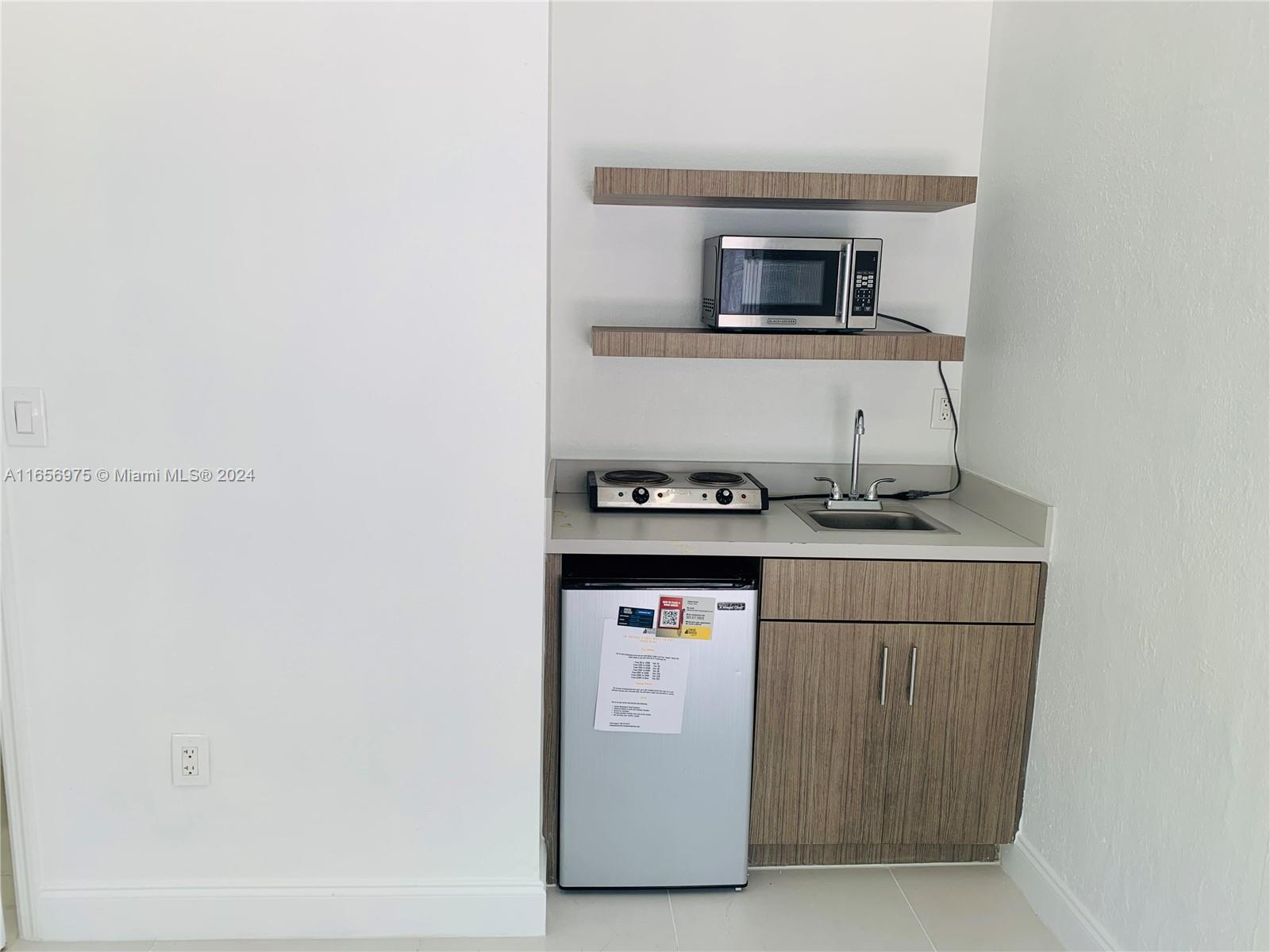 a kitchen with a stove and a microwave