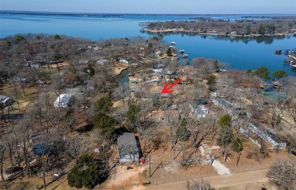 a aerial view of a houses with a lake