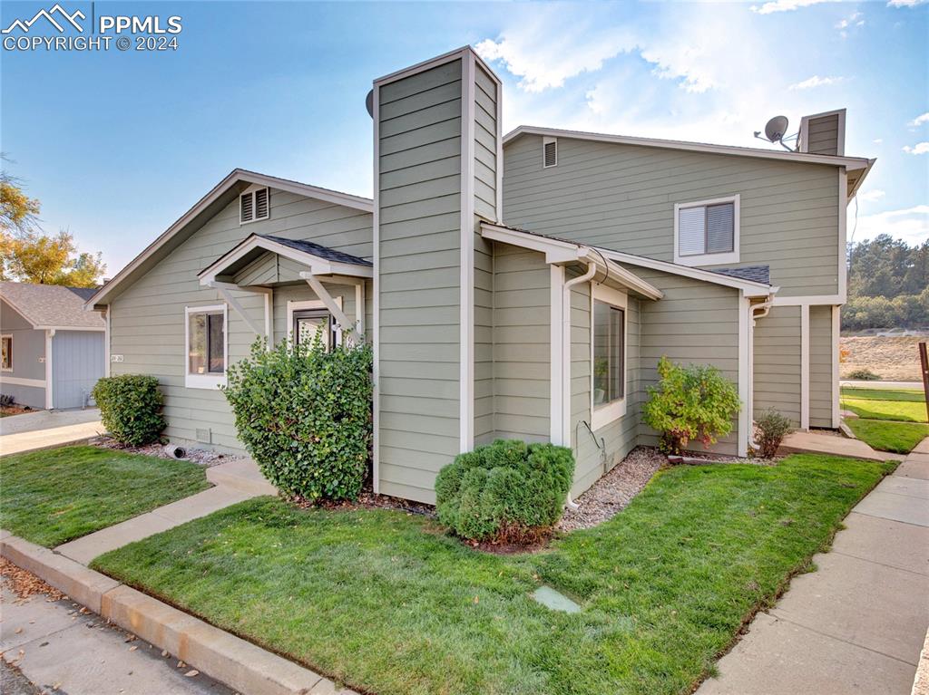 a front view of a house with a yard