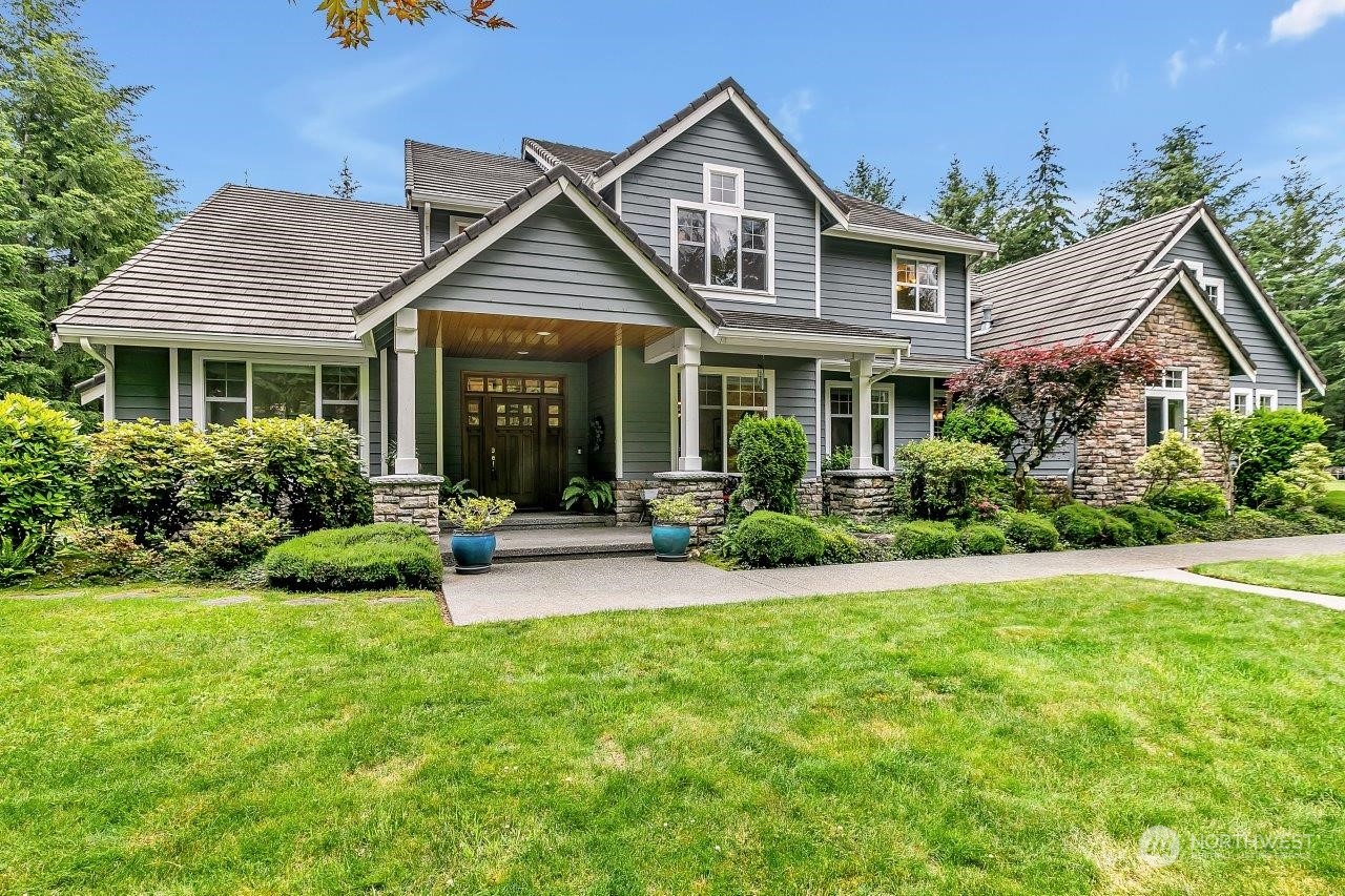 a front view of a house with a yard and porch