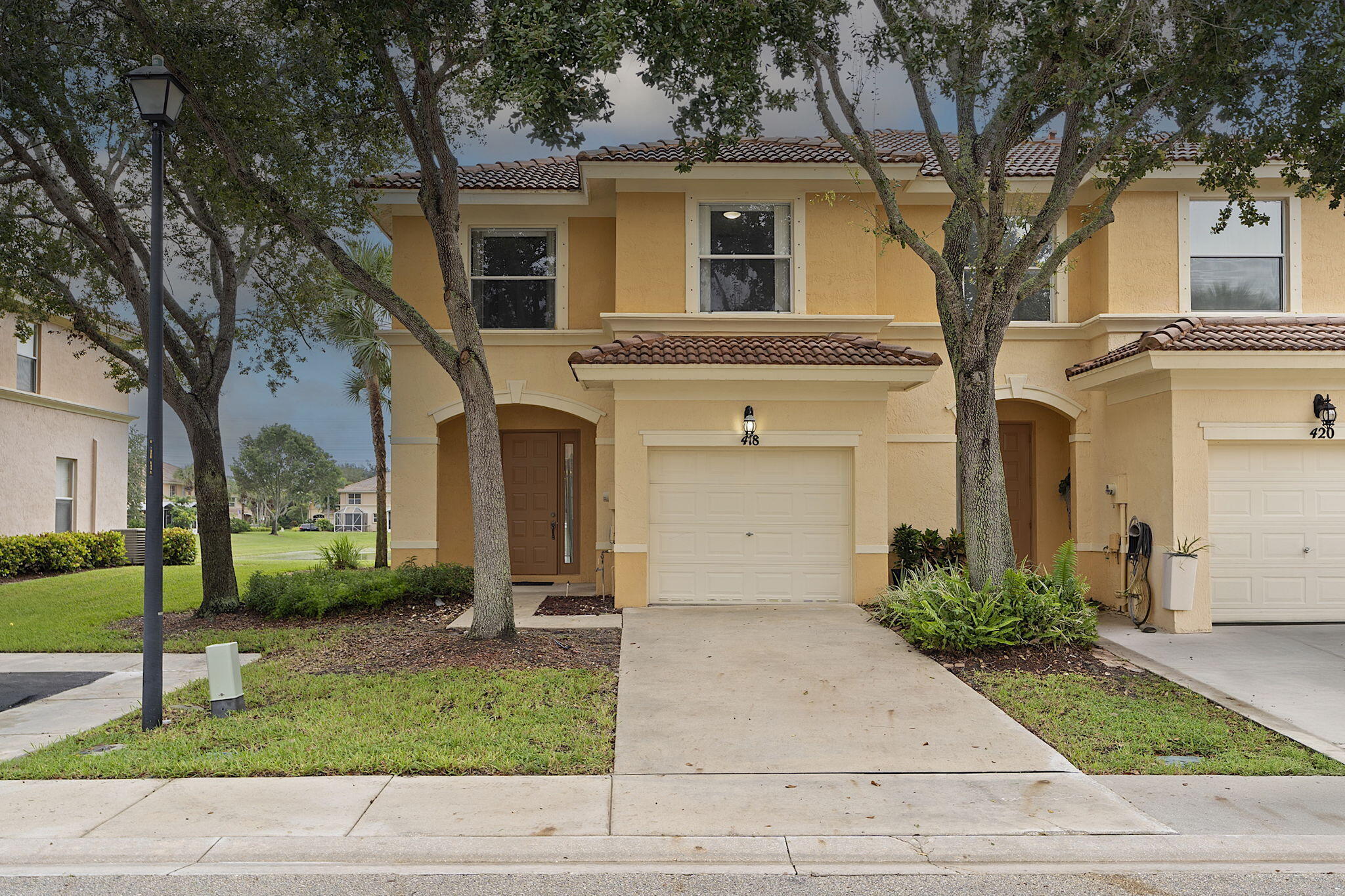 a front view of a house with garden