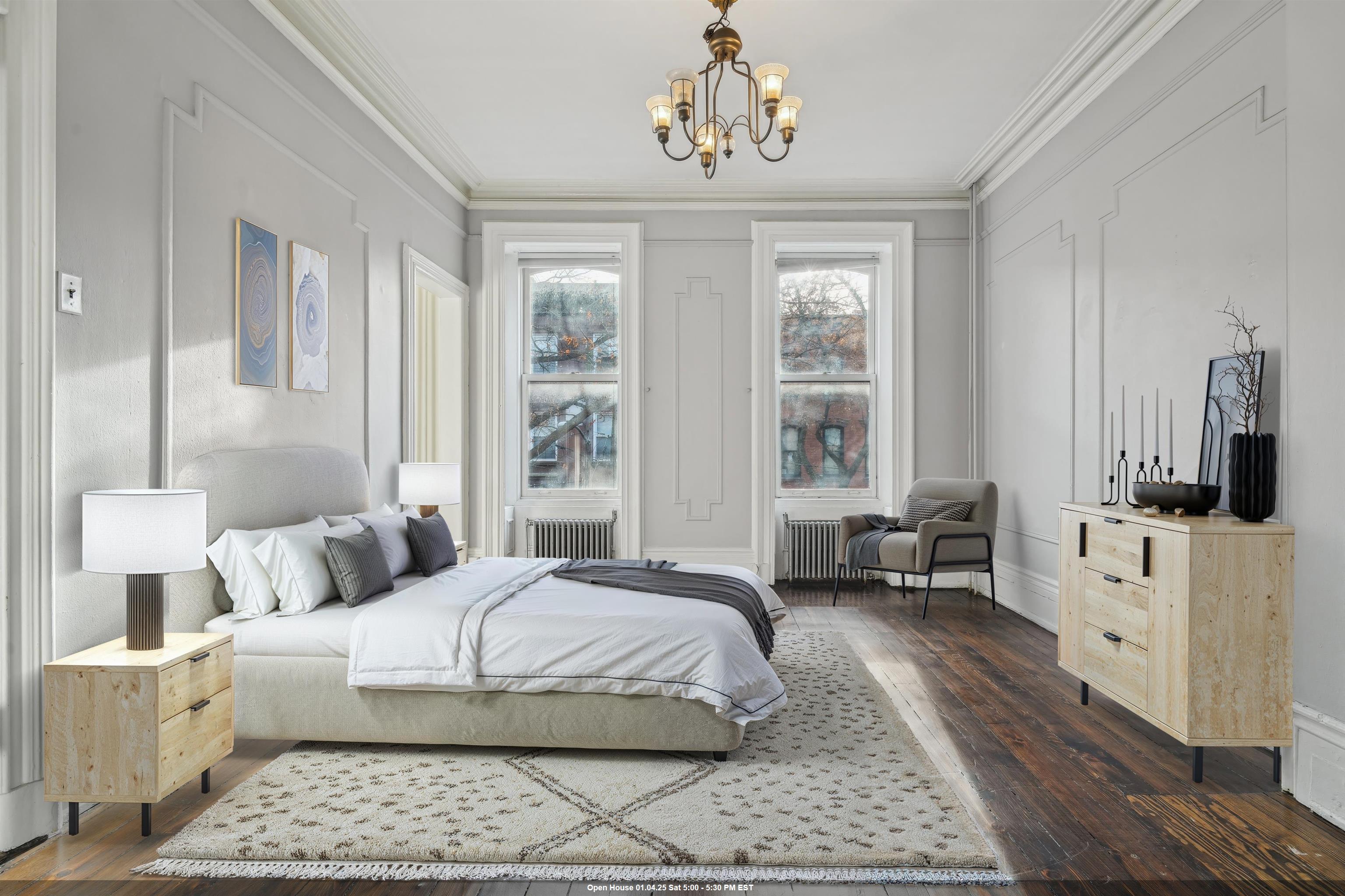 a bedroom with a large bed and a window