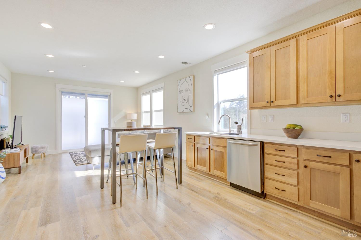 The spacious kitchen and living area are light and bright with plenty of cabinet space.
